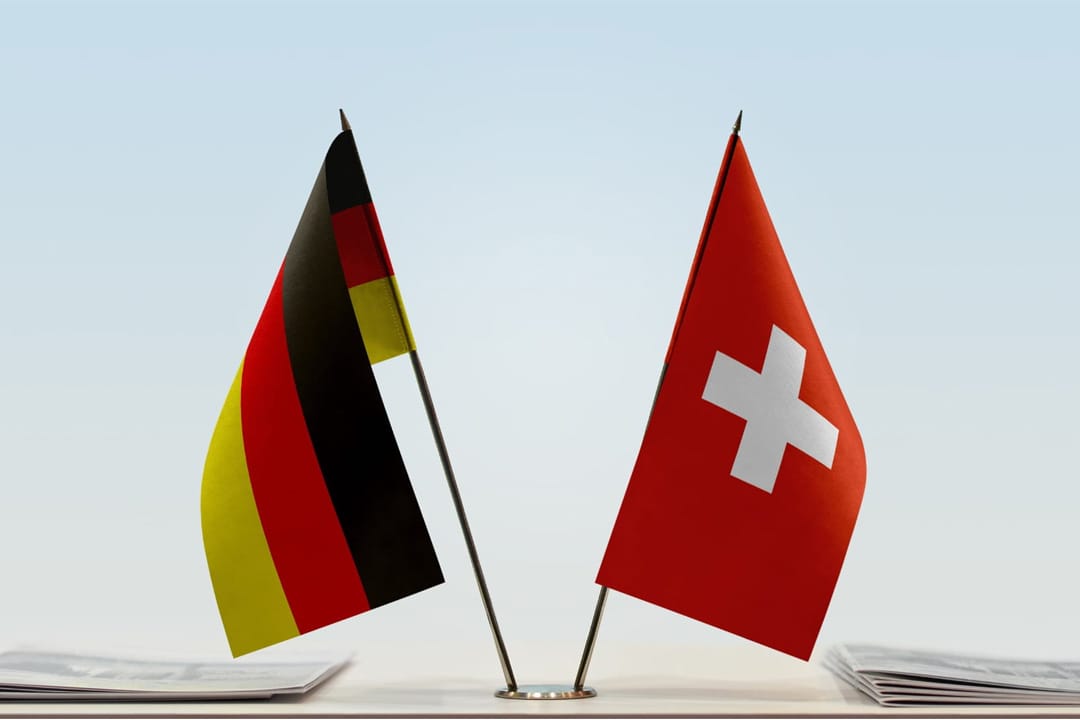 German flag on the left and Swiss flag on the right